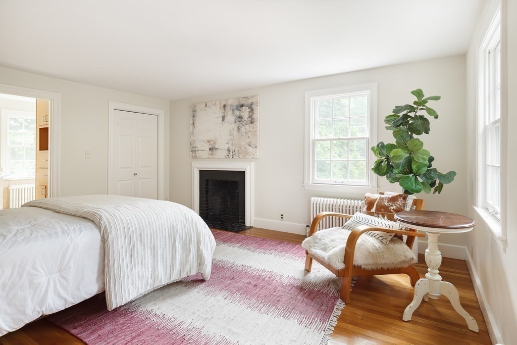 150 Fletcher Road Belmont, MA 02478 - Photo 29 of 33 a bedroom with a bed and a chair