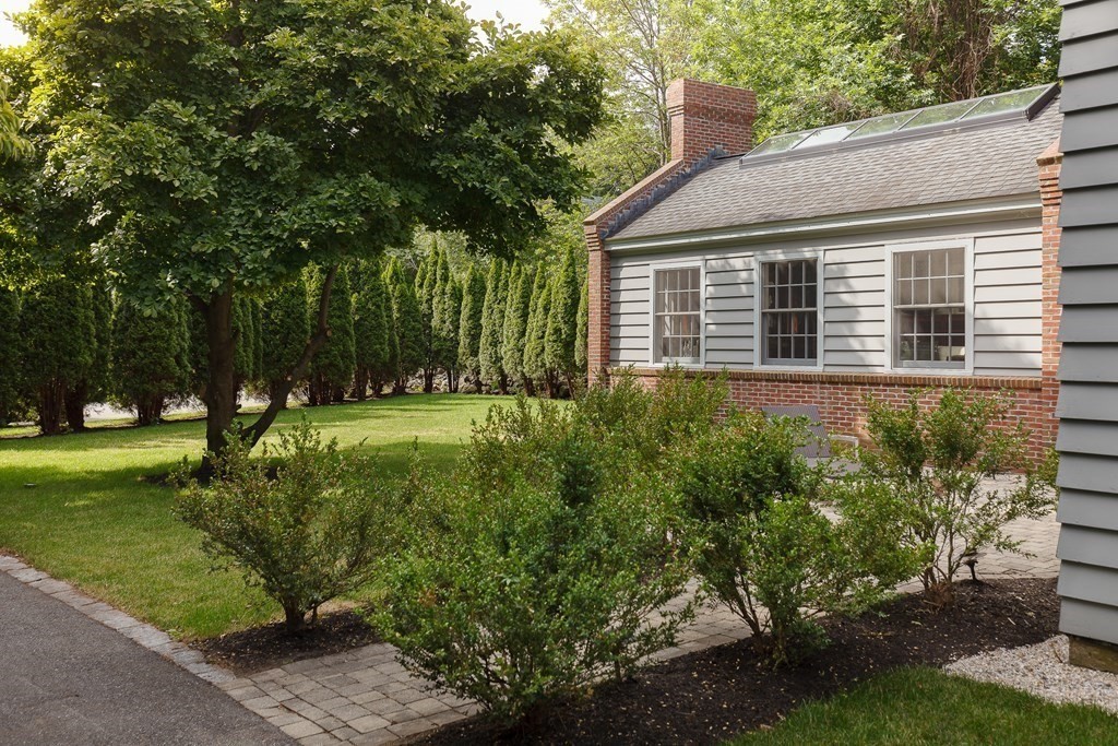 150 Fletcher Road Belmont, MA 02478 - Photo 32 of 33 a view of a house with a garden