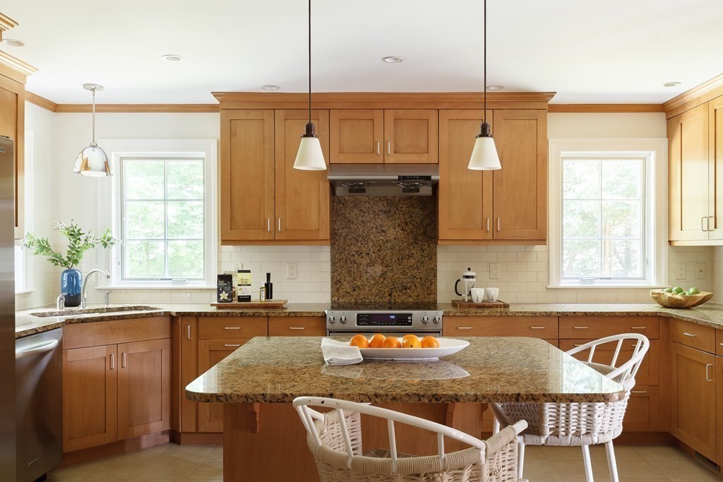 150 Fletcher Road Belmont, MA 02478 - Photo 7 of 33 a kitchen with a table chairs and microwave