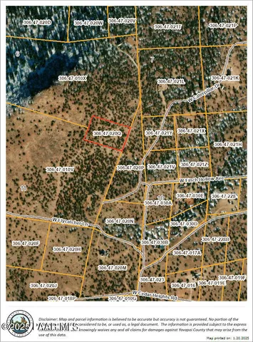 a view of a field with trees in the background