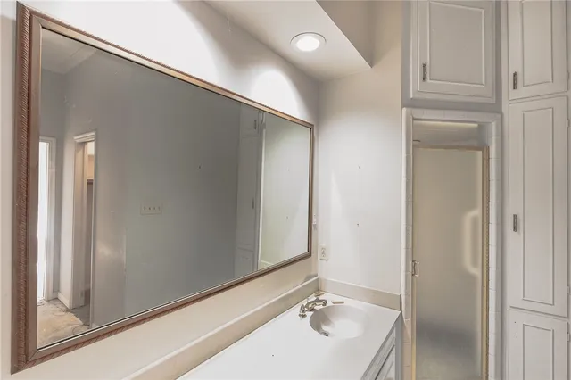 a bathroom with a sink and a mirror