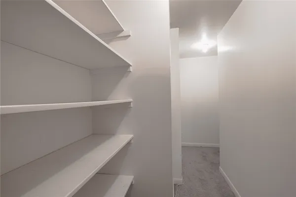 a view of an empty walk in closet