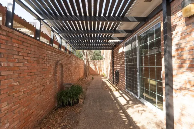 a porch with swimming pool in front of house