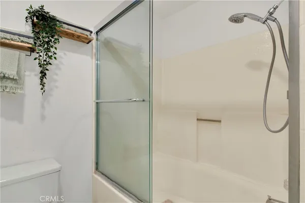 a view of hallway with toilet