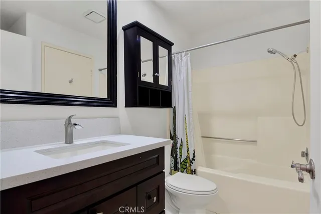 a view of a hallway with washer and dryer