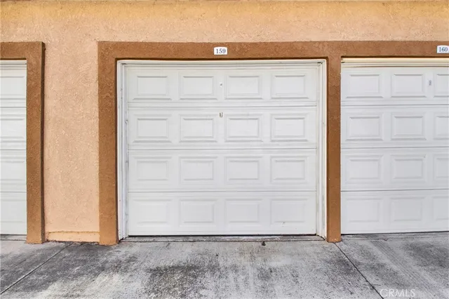 an aerial view of residential houses with outdoor space and street view
