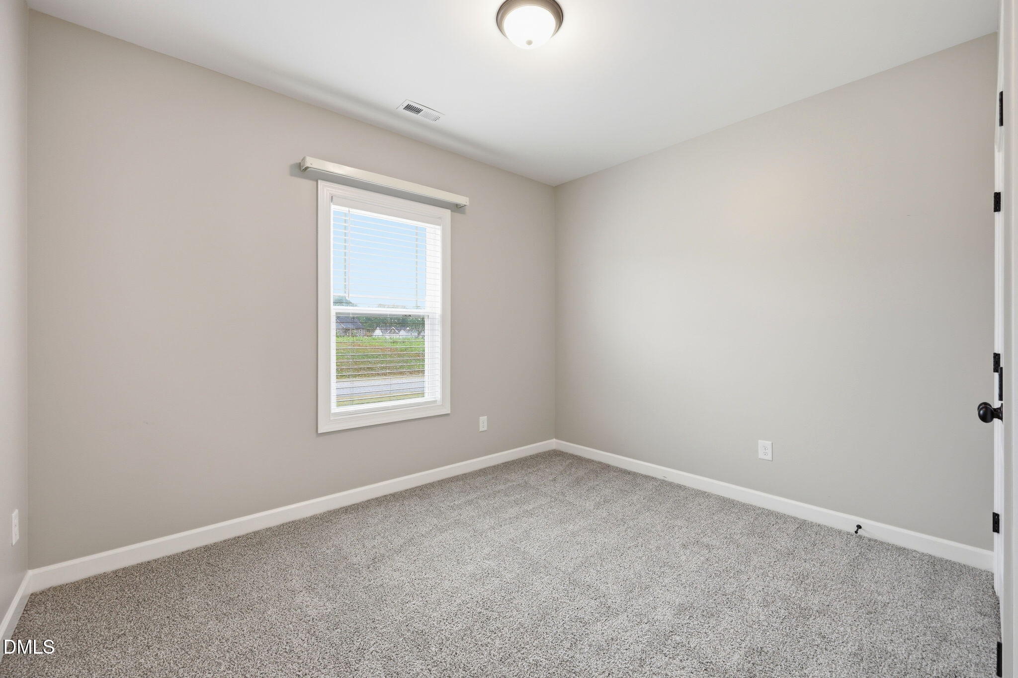 146 Seahawk Way Zebulon, NC 27597 - Photo 31 of 51 an empty room with a window