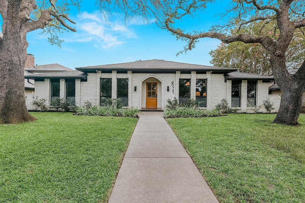 9044 Church Road Dallas, TX 75231 - Photo 1 of 1 View of front of property featuring brick siding, a front lawn, and a shingled roof