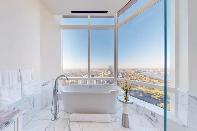 a bathroom with a bathtub and shower