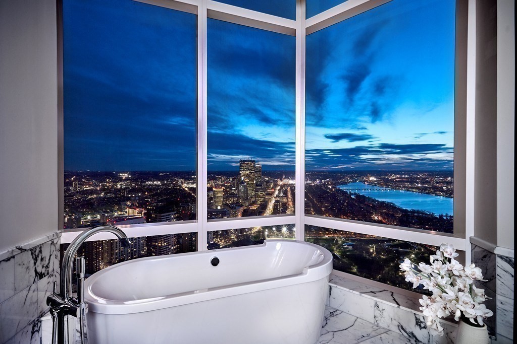 1 Franklin Street, Unit PH4E Boston, MA 02110 - Photo 25 of 40 a bathroom with a bathtub and shower