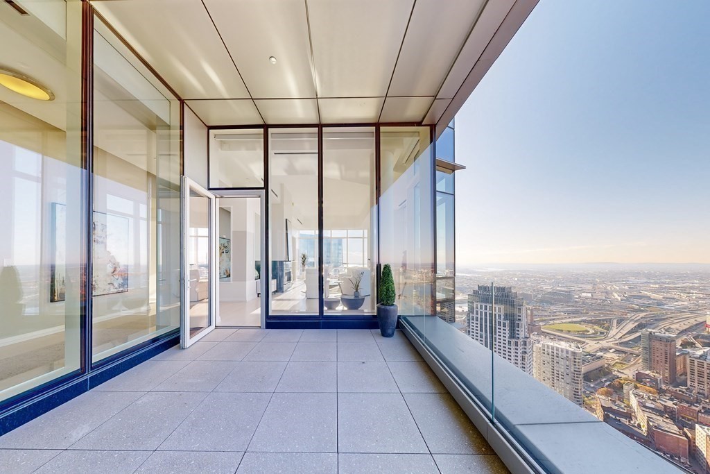 1 Franklin Street, Unit PH4E Boston, MA 02110 - Photo 3 of 40 a view of a city from a balcony