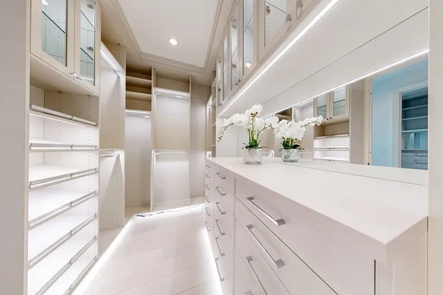 a spacious bathroom with a double vanity sink and a mirror