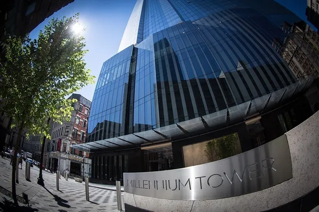 a view of a chairs and table in the backyard