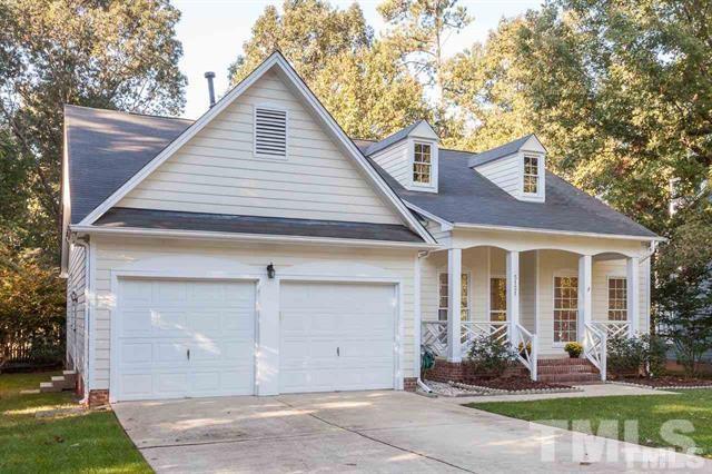 5121 Fairmead Circle Raleigh, NC 27613 - Photo 1 of 21 a front view of a house with a yard and garage