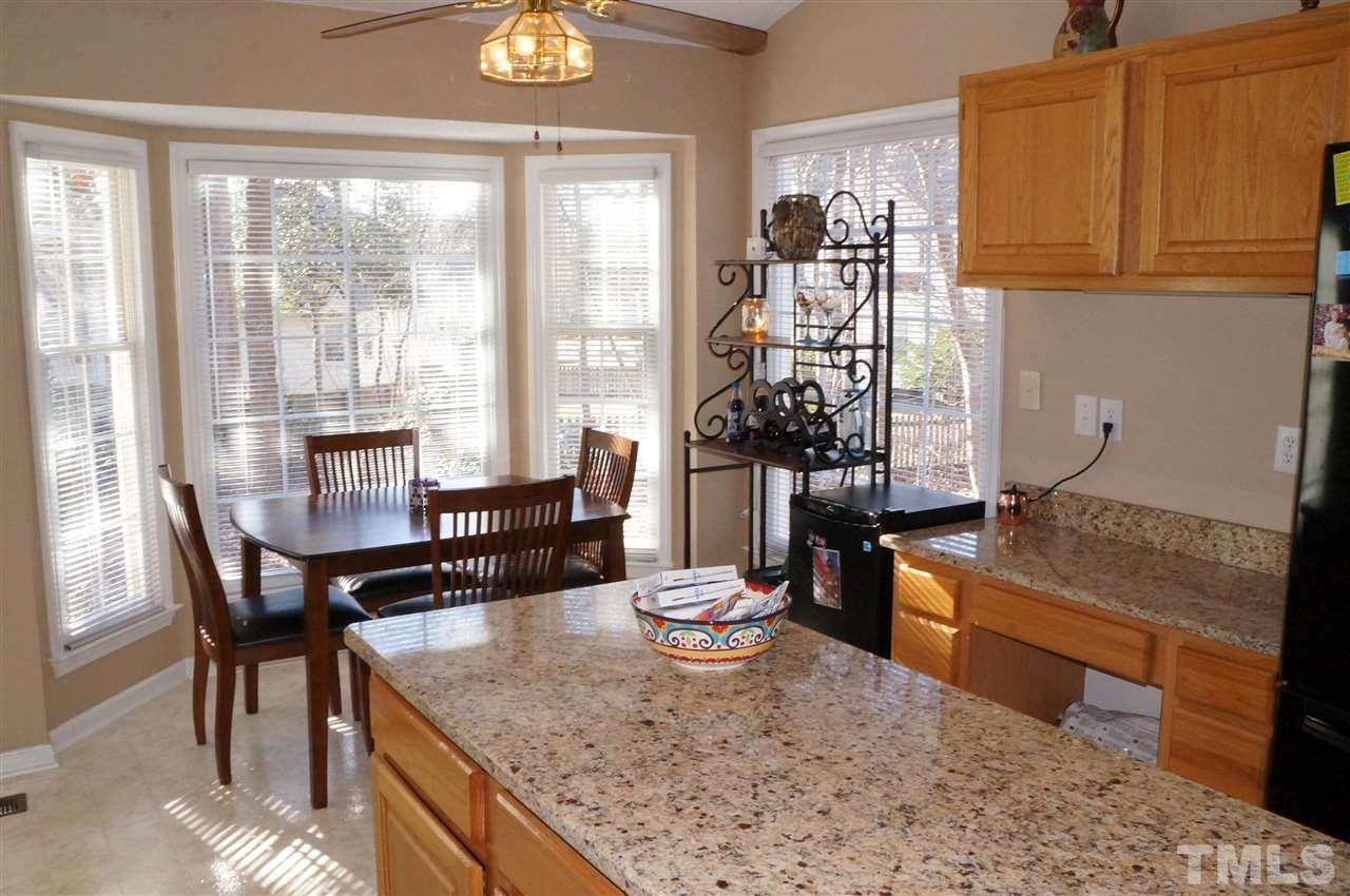 5121 Fairmead Circle Raleigh, NC 27613 - Photo 11 of 21 a view of a dining room with furniture window and outside view