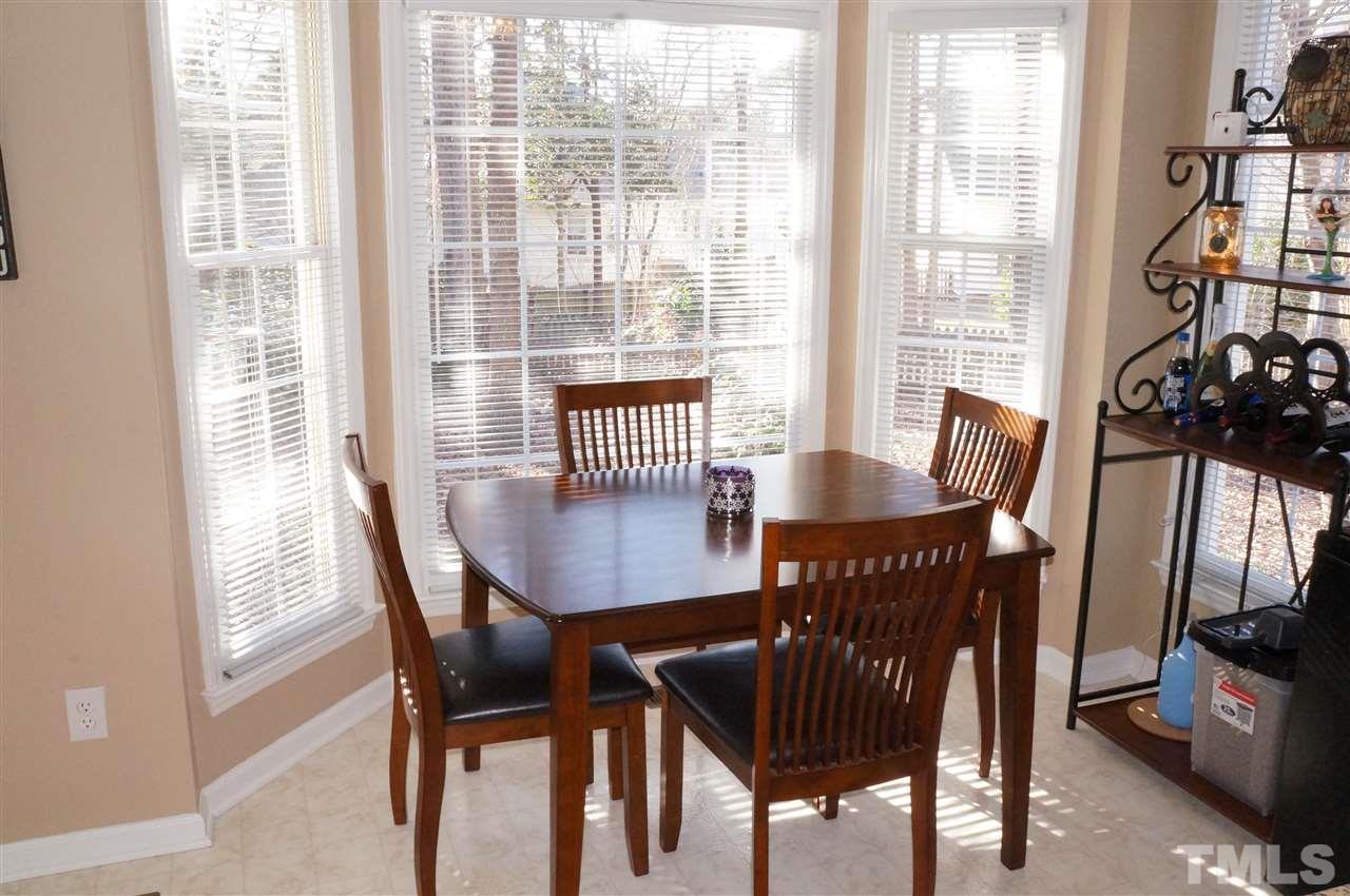 5121 Fairmead Circle Raleigh, NC 27613 - Photo 12 of 21 a view of a dining room with furniture window and outside view