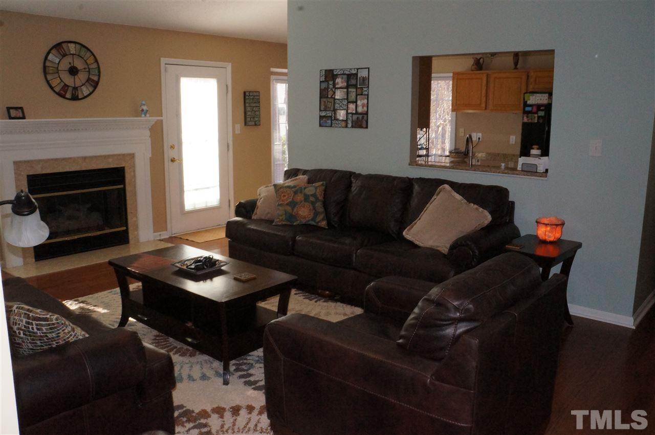 5121 Fairmead Circle Raleigh, NC 27613 - Photo 14 of 21 a living room with furniture and a fireplace