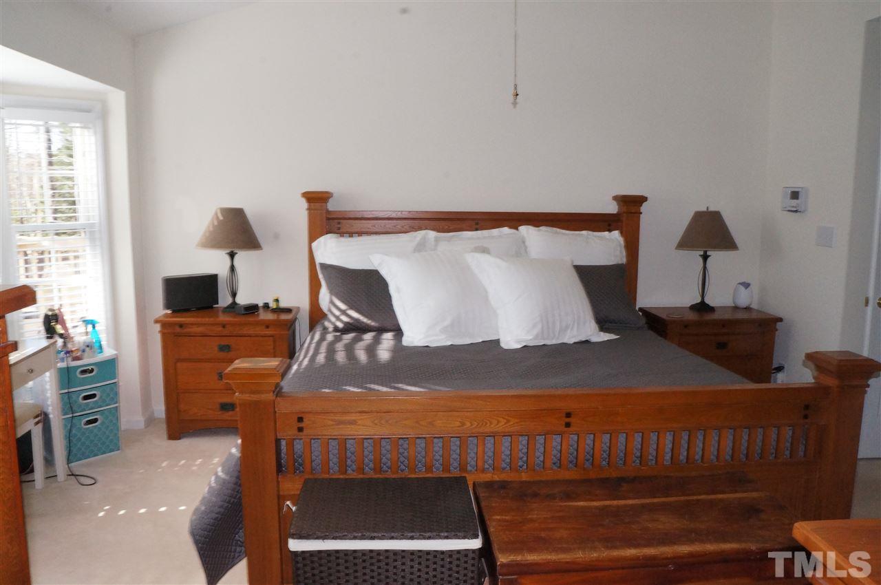 5121 Fairmead Circle Raleigh, NC 27613 - Photo 17 of 21 a bedroom with a bed and a window