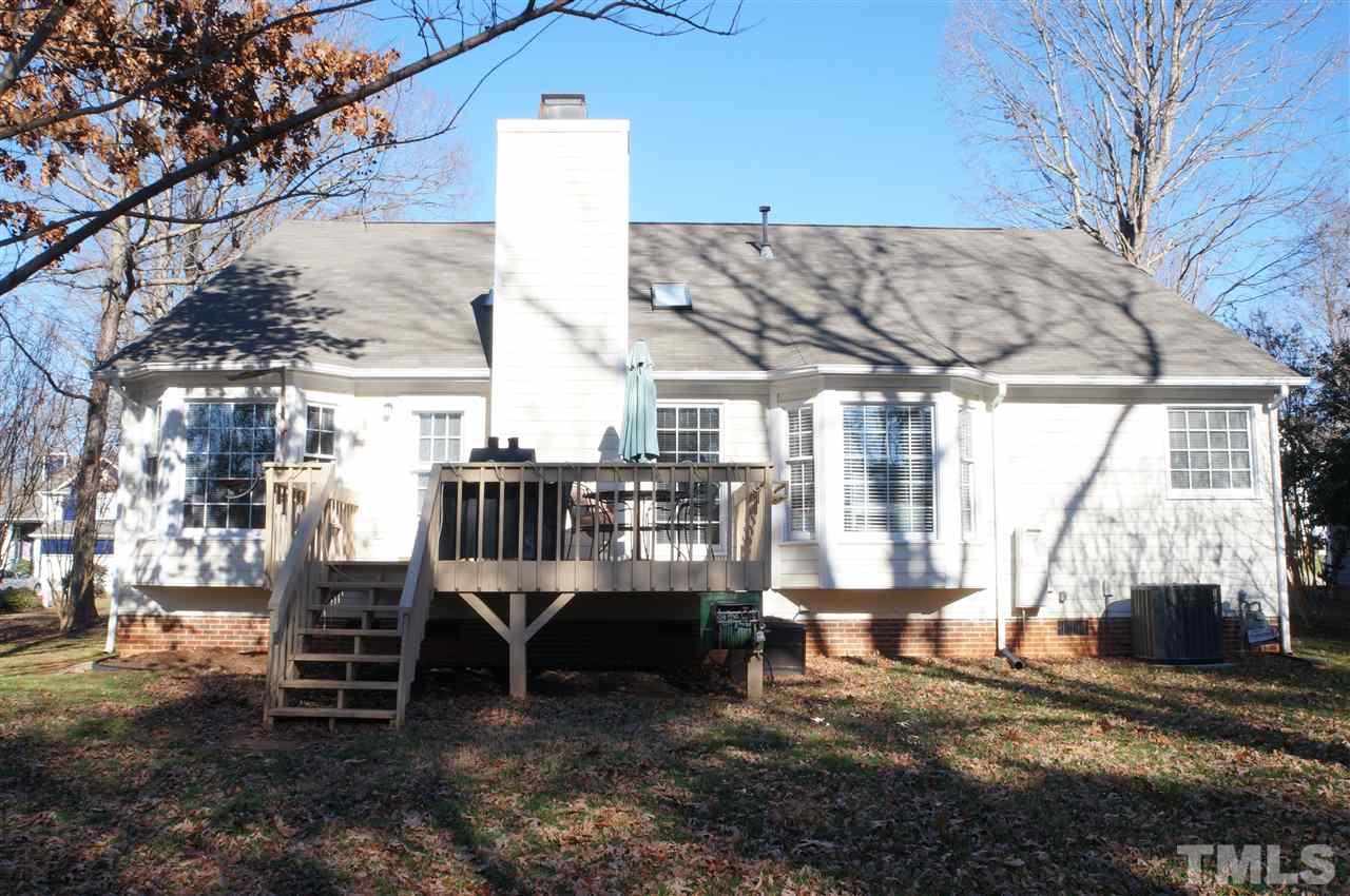 5121 Fairmead Circle Raleigh, NC 27613 - Photo 19 of 21 a view of a patio with a table chairs and a fire pit