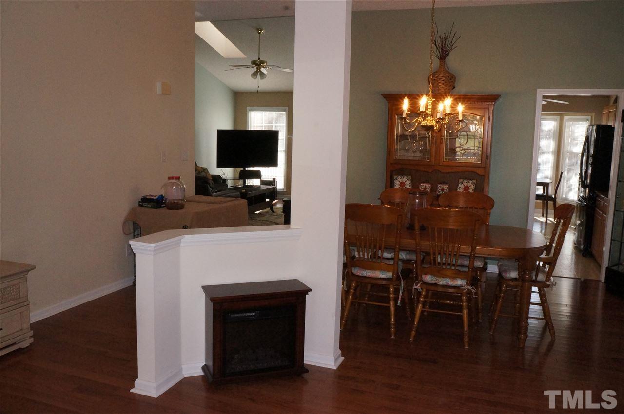 5121 Fairmead Circle Raleigh, NC 27613 - Photo 7 of 21 a view of a dining room with furniture and wooden floor