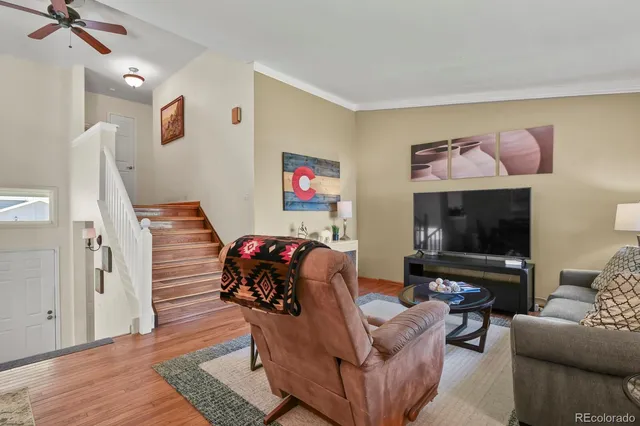 a living room with furniture and a flat screen tv