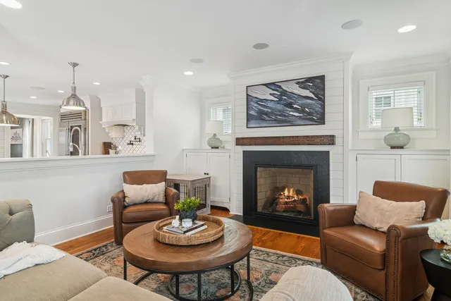 a view of a livingroom with furniture window and wooden floor