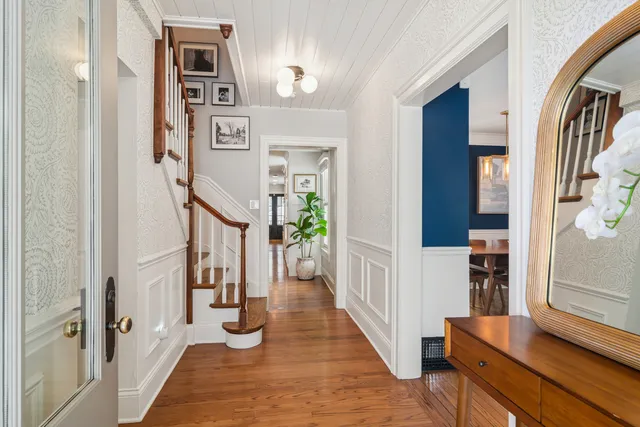 a bathroom with a granite countertop sink a mirror and vanity