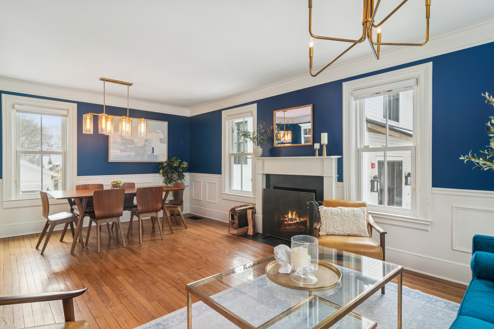 526 South Grove Avenue Barrington, IL 60010 - Photo 17 of 50 a living room with furniture a dining table and a fireplace