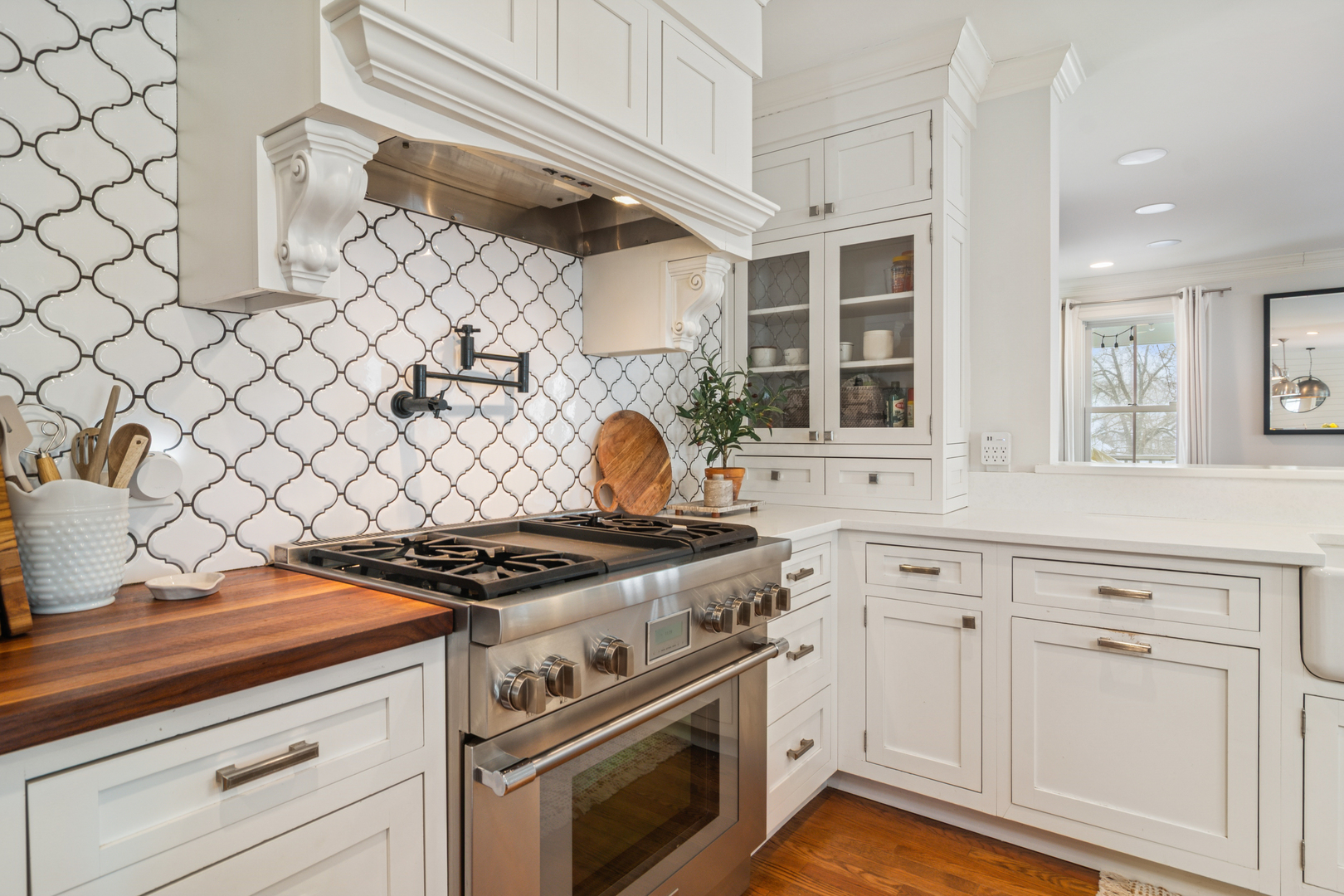 526 South Grove Avenue Barrington, IL 60010 - Photo 6 of 50 a kitchen with granite countertop white cabinets and white stove
