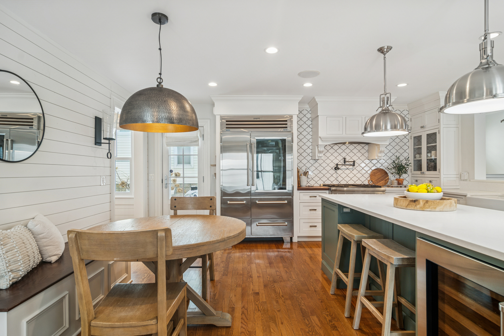 526 South Grove Avenue Barrington, IL 60010 - Photo 9 of 50 a kitchen with stainless steel appliances granite countertop a sink a stove and chairs