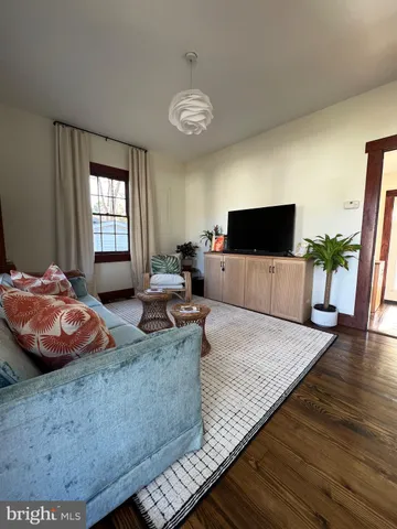 a bedroom with a bed and flat screen tv