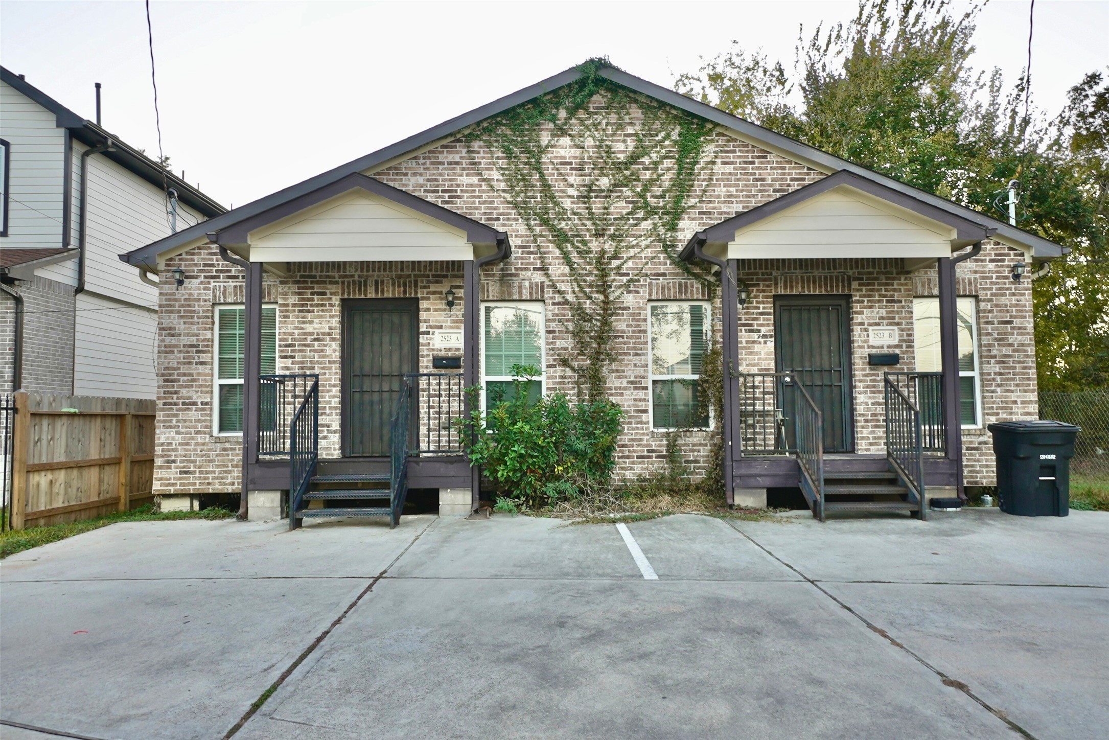 2523 Kirk Street, Unit B Houston, TX 77026 - Photo 1 of 16 a front view of a house with garden