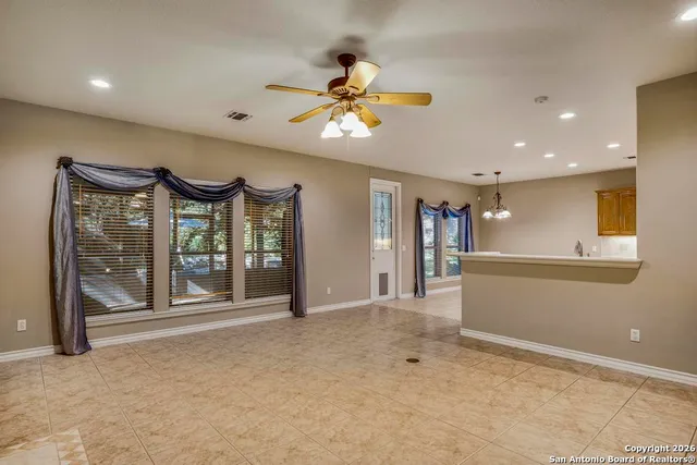 a view of livingroom with furniture and windows