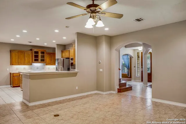 a view of a living room with furniture and a chandelier