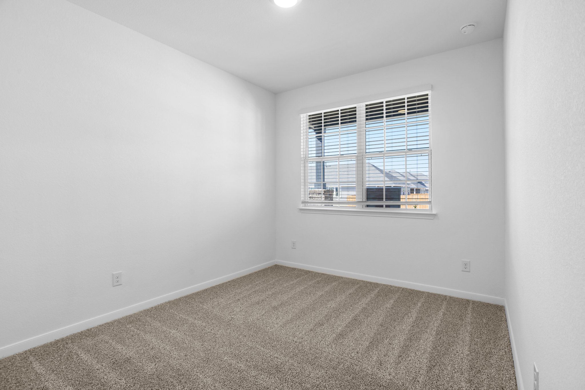 305 Brooks Ranch Drive Kyle, TX 78640 - Photo 8 of 32 an empty room with a window