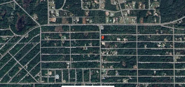 a view of a wooden door with a room