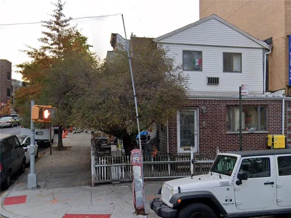 a car parked in front of a house