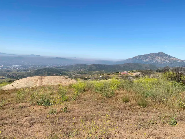 a view of an ocean and a mountain