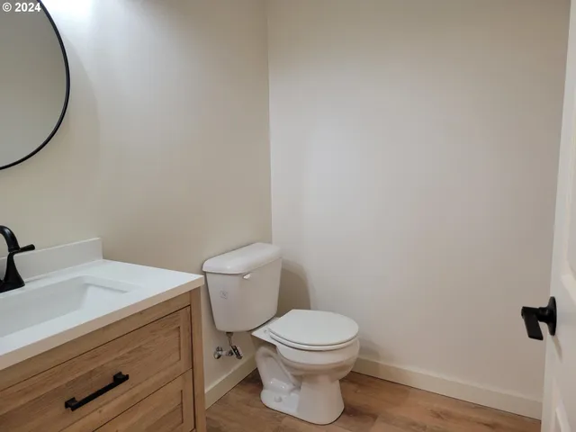 a white toilet sitting next to a bathroom sink