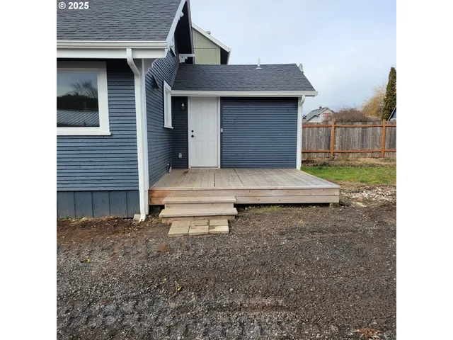 a bedroom with a bed dresser and a window