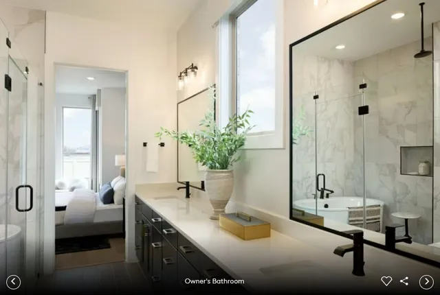a bathroom with a double vanity sink a mirror and shower