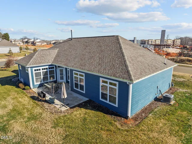 a aerial view of a house with roof deck