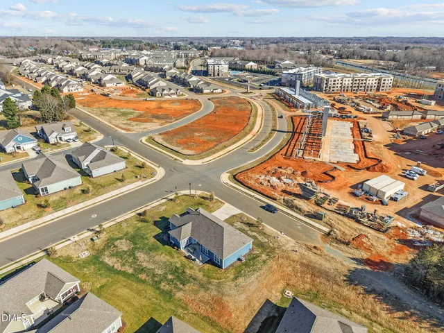 an aerial view of a residential building and lake view