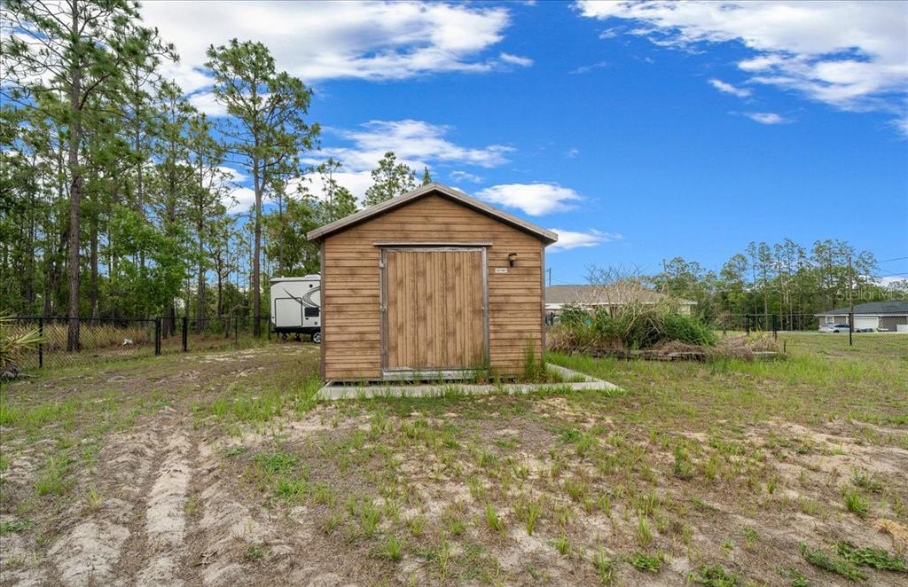 234 Locust Lane Ocala, FL 34472 - Photo 21 of 71 a view of a backyard with large trees