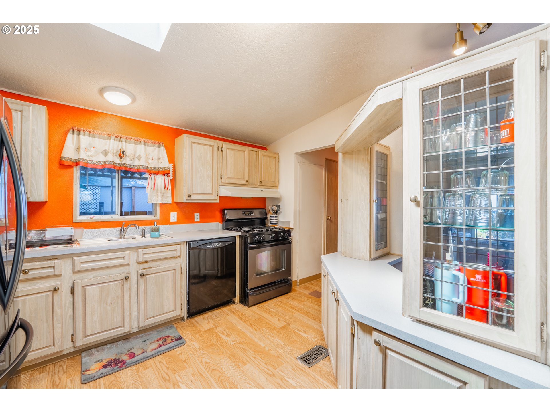 5064 Silver Loop Northeast Salem, OR 97305 - Photo 11 of 27 a kitchen with stainless steel appliances kitchen island granite countertop a sink and cabinets