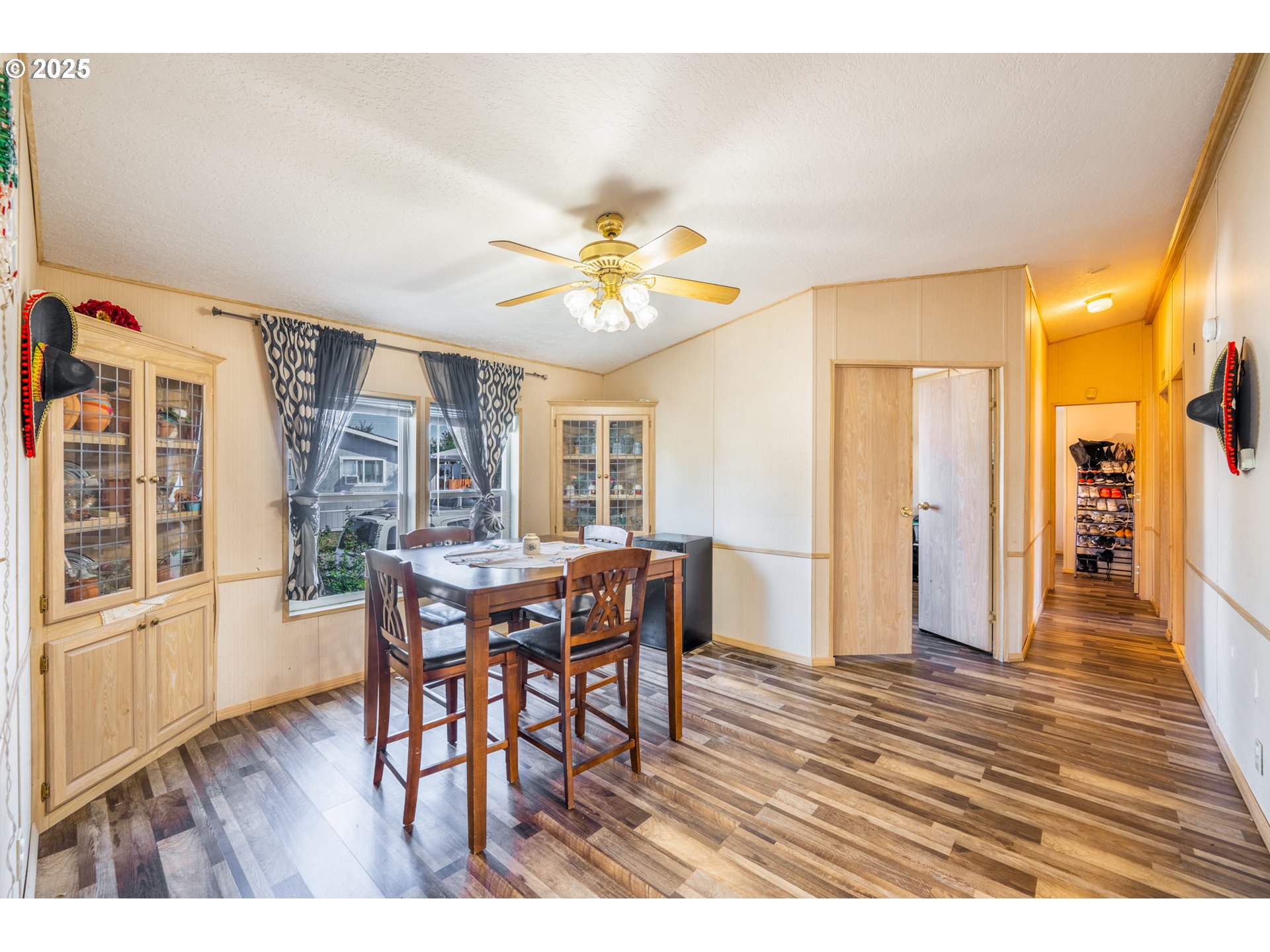 5064 Silver Loop Northeast Salem, OR 97305 - Photo 16 of 27 a view of a dining room with furniture and wooden floor