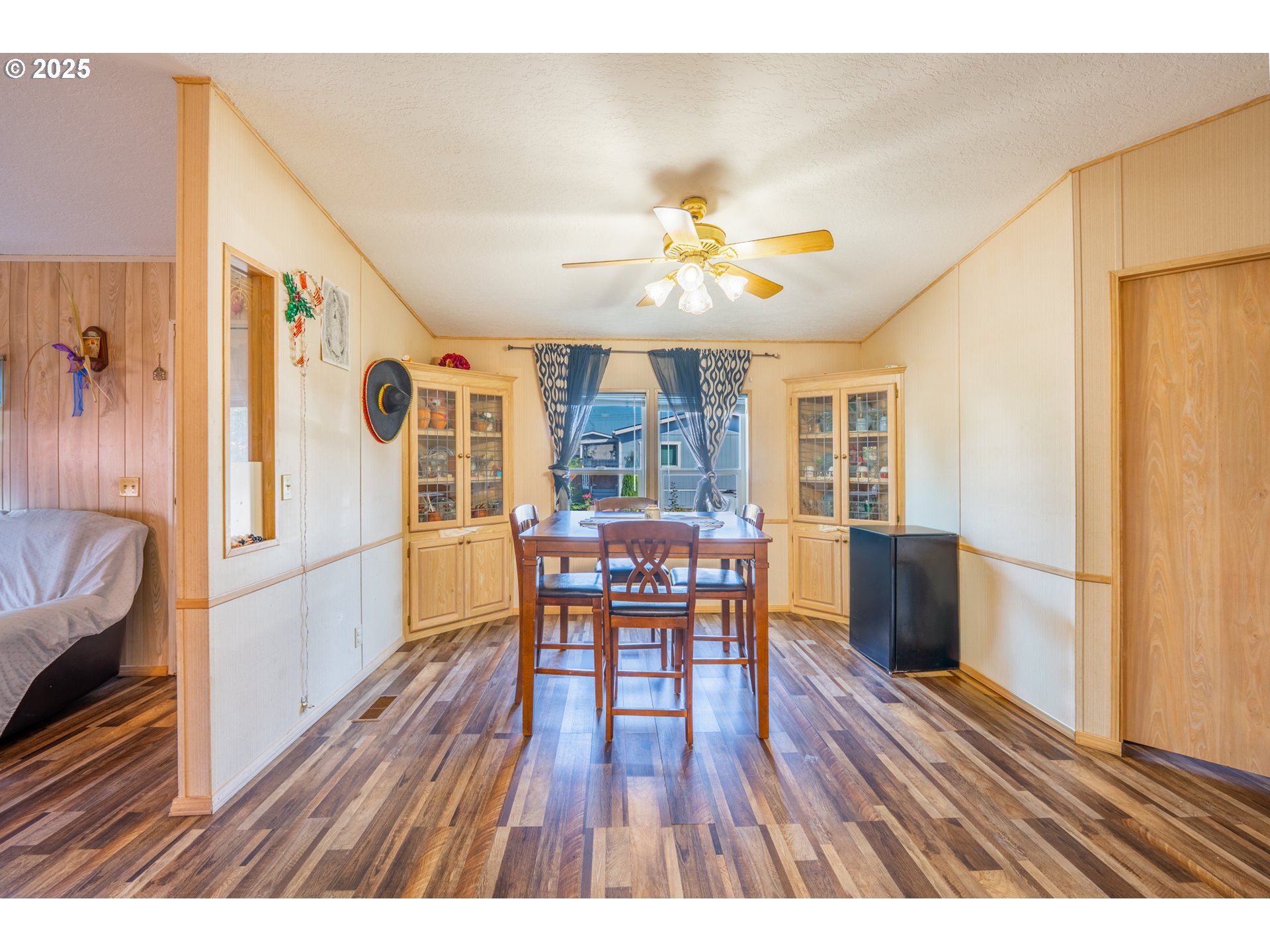 5064 Silver Loop Northeast Salem, OR 97305 - Photo 17 of 27 a view of a dining room with furniture a kitchen and chandelier