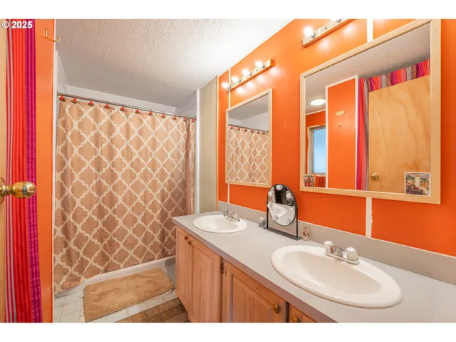 a bathroom with a sink a vanity and a mirror