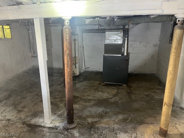 973 Nevin Street Akron, OH 44310 - Photo 19 of 19 Unfinished below grade area with heating unit and water heater