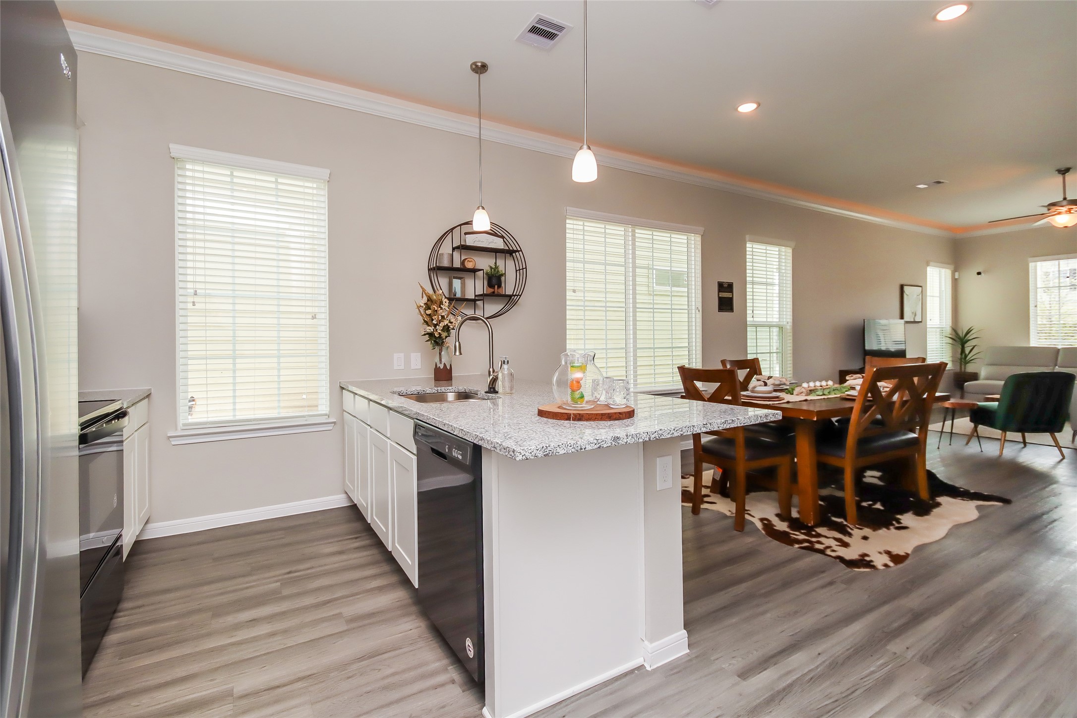 19006 Yellow Bells Way Rosharon, TX 77583 - Photo 5 of 24 a view of kitchen with stainless steel appliances granite countertop sink stove and wooden floor